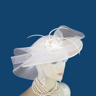Ladies White Formal Satin Shallow Crown Medium Wide Brim Wedding Hat. This Dress Hat Is Trimmed With A Large Sheer Bow, Adorned With A White Satin Rosette. Pearl Trim Wraps Around The Crown And Brim Of This Elegant Hat. This Sophisticated Hat Is Suited For A Bride To Be. This Formal Hat Is Custom Made And Designed By WomensDesignerHats.com. This dress hat is suited for Winter, Spring, Summer And Fall. A perfect special occasion hat for weddings, formals, Church and holidays.