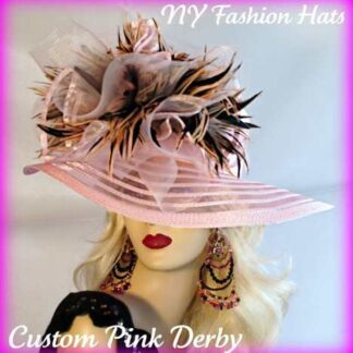 Ladies Soft Pink  Designer Sheer Wide Brim Fashion Haute Couture Kentucky Derby Horse Racing Hat Embellished With Pink And Brown Striped Tiger Type Feathers. A Large Pink Horse Bow And A Pink Organza Bow With Pink Satin Edging Is Mixed Into The Feather Mix. This Romantic Styled Avant Garde Hat, Will Make Any Women Feel Feminine. This Dress Hat Is Suited For A Bride To Be On Her Wedding Day, Or For Wedding Guests. This Dress Hat Is Suited Also For Church, Weddings, Formals, Holidays And Special Occasions.