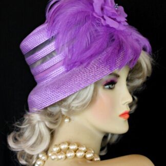 Ladies Purple Haute Couture Straw Braid Designer Fashion Hat For Special Occasions, The Kentucky Derby Or The Kentucky Oaks Horse Race. This Haute Couture Headpiece Is Trimmed With Beautiful Purple Feathers, Accented With A Custom Made Delicate Purple Silk Rose Millinery Rose. A Beautiful Dress Hat For A Bride, Wedding Guest Or Church. This Special Occasion Hat Is Custom Made And Designed By Women's Designer Hats At HatsWomens.com - NYFashionHats.com Couture Millinery.