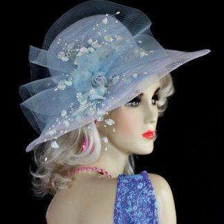 Ladies Pastel Baby Blue Designer Kentucky Derby Hat. This Fashion Hat Is Embellished With A Baby Blue Sheer Crin Netting Bow, Accented With Baby Sky Blue Silk Millinery Flowers, Including Rose Buds. Sweeping White Pearls Give This Formal Hat Such A Feminine Touch. A Lovely White Trim Wraps Around The Crown Of This Elegant Hat. This dress hat is suited for Winter, Spring, Summer And Fall.