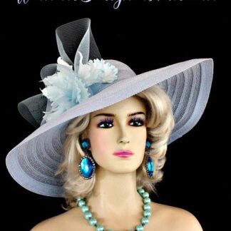 Soft Baby Wedgewood Blue Wide Brim Designer Wedding Kentucky Derby Hat With Orchids For Women. This Dress Hat Is Adorned With A Large Crinoline Baby Blue Bow, Accented With Custom Dyed Baby Blue Orchids.