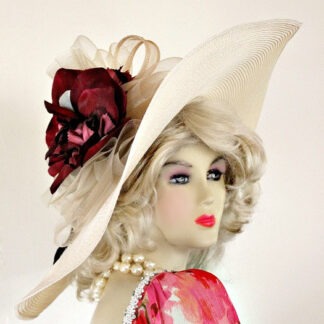 Ivory And Burgundy Wide Brim Haute Couture Designer Kentucky Derby Fashion Hat For Women. This Designer Dress Hat Is Trimmed With A Sheer Crinoline Netting Ivory Bow, Mixed With An Ivory Sinamay Straw Bow, Enhanced With A Custom Dyed Ivory And Silk Millinery Flowers. Delicate Burgundy Feathers Are Placed Behind The Flower For Added Design. This Versatile Hat Can Be Worn In Different Positions. This Feminine Hat Has Such A Romantic Feel. This Exquisite Southern Belle Hat, Is Custom Made And Designed By WomensDesignerHats.com. We Specialize In Formal Hats For Women, Custom Hats For Women, High Fashion Hats, Haute Couture Hats, Wedding Hats, Kentucky Derby Hat, Ladies Dress Hats, Church Hats, And Special Occasion Hats.