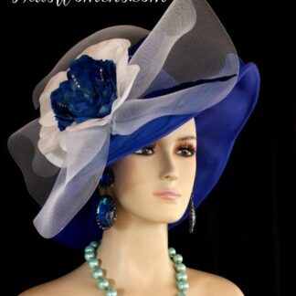 Ladies Haute Couture Royal Blue And White Lightweight Chiffon Wide Brimmed Designer Special Occasion Fashion Couture Hat. This Formal Dress Hat Is Trimmed With A Large White Crinoline Bow, Accented With A Hand Made Royal Blue And White Silk Flower, Trimmed With Rhinestones. Expensive Hand Made Royal Blue Leaf Petals Are Placed Around The Flower. This Is A Stunning Hat For The Spring Horse Races, The Kentucky Derby, The Belmont Stakes, The Preakness Stakes, The Royal Ascot, The Melbourne Cup, And The Royal Ascot.