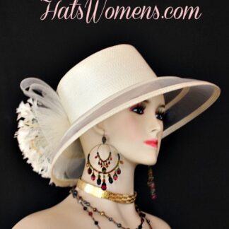 Ladies Ivory Soft Beige Haute Couture Wide Sheer Brim Formal Fashion Kentucky Derby Hat With Expensive Feathers. This Custom Made Women's Designer Hat Is Embellished With A Large Ivory Crinoline Bow, Accented With Beautiful Ivory Feathers. This Beautiful Designer Hat Is Suited For A Bride To Be On Her Wedding Day, Horse Races, The Kentucky Derby, Breeder's Cup, Maryland Million Day, Iroquois Steeplechase Horse Races, The Melbourne Cup, The Royal Ascot, Church, Weddings, Formals, And Special Occasion. This Fashion Hat Is Custom Made By Women's Hats, hatswomens.com. NYFashionHats.com