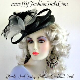 Women's Black Dressy Pillbox Cocktail Hat, With A Large Ivory BowAnd Black Feathers. A Hat Pin, Is Included with this cocktail hat. This Fashion Hat, Is Suited For Weddings, Black Tie, Holiday Parties, Church, Temple, Formals, And Special Occasion. Custom Designed And Made, By www.NYFashionHats.Com