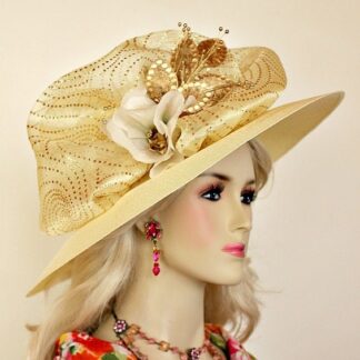 Haute Couture Banana Ivory Beige Wide Brim Luxury Statement For Women. This Hand Made Fashion Hat Is Trimmed With An Ivory Organza Bow Embellished With Metallic Gold Circles. Placed Around This Beautiful Bow Are Ivory Silk Millinery Flowers And Metallic Gold Custom Dyed Velvet Flowers With Gold Sequin. This Designer Custom Made Hat Is A Show Stopper. A Perfect Kentucky Derby Or Kentucky Oaks Horse Racing Hat. Custom Made And Designed By Women's Designer Hats, www.womensdesignerhats.com