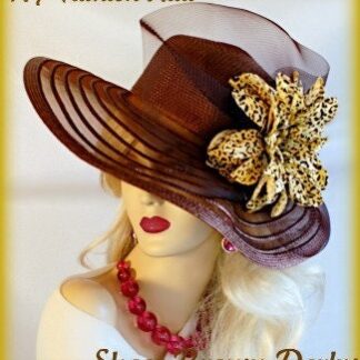 Ladies Custom Made, Formal Brown Designer Wide Brimmed Fashion Kentucky Derby Hat. This brown dress hat, is adorned with a large brown sheer bow, adorned with a gold and brown leopard flower. This elegant hat, represents timeless elegance, at its finest. A perfect hat, to wear for horse racing, the Kentucky Derby, and other sports events.