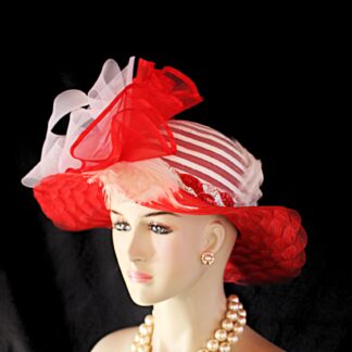 Haute Couture Red And White Designer Fashion Hat For The Kentucky Derby Formals Weddings And Special Occasion. This Custom Designed Women's Dress Hat Is Trimmed With A Large Sheer White Horsehair Crinoline Rosette Bow Mixed With A Red Large Organza Bow Embellished With A Red Satin Edge. White Rooster Hackle Feathers Are Placed Along The Brim And Crown Of This Gorgeous Hat. The Crown Of This Elegant Hat Is A White Horsehair Mixed With A Poly Braid. The Brim Is Made Of A Scalloped Design Than Runs Throughout The Brim.