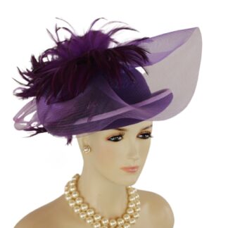 Haute Couture Motif Premium Purple Winter Wool Big Bow Feathered Designer Statement Wedding Church Hat For Women. This Old Hollywood Vintage Inspired Wool Fall Hat Is Trimmed With A Big Multi Colored Purple Horsehair Crinoline Bow. Placed Within The Beautiful Bowing Are Expensive Deep Purple Rooster Hackle Feathers. A Soft Purple Velvet Trim Encircles The Lower Portion Of The Crown As Well As Around The Outside Of The Rolled Up Brim On This Fashion Hat. This Avant Garde Fashion Hat Speaks For Itself With Its Haute Couture Design.