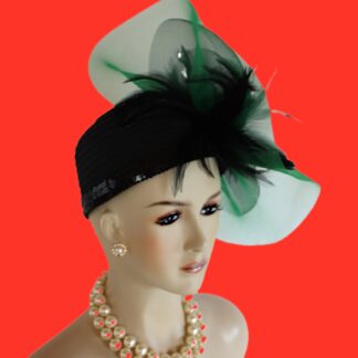 Black And Kelly Green Haute Couture Avant Garde Designer Satin Pillbox Fashion Hat For Women. This Hand Made Motf Premium Black Satin Designer Dress Hat Is Trimmed With A Large Black And Kelly Green Double Crinoline Horsehair Handmade Large Bow. Placed Within And Around This Big Bow Are Expensive Long Black Hackle Rooster Feathers. To Top Off This Luxury Black Satin Pillbox Hat, Black And Green Speckled Guinea Feathers Are Added As A Center Accent Piece. This Designer Custom Made Hat Is A Show Stopper. Suited For Winter, Spring, Summer And Fall. This Beautiful Hat Speaks For Itself With The High Fashion Millinery Design.