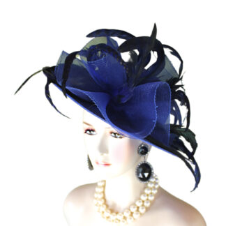 Women's Couture Royal Blue Wide Brim Designer Church Wedding Hat Headpiece. This Custom Fashion Hat Is Embellished With A Large Royal Blue Crinoline Horse Hair Bow Accented With Expensive Long Royal Blue Coque Rooster Feathers With Irisdent Darkened Royal Blue Black Stripes. An Intricate Decorative Royal Blue Lace Trim Encircles The Crown Of This Glamorous Hat. A Royal Blue Satin Trim Is Place On The Bottom Edge Of The Lace For A Romantic Flair.