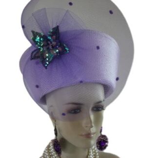 Lavender Soft Purple Haute Couture High Crown Nefertiti Style Women's Pillbox Hat Headdress, Formal Wedding Dress Mother Of The Bride Hat. This Glamorous Avant Garde Hat Is Made And Designed By NY Fashion Hats Millinery For Women. This Beautiful Hat Is Adorned With A Large Lavender Purple Horsehair Crinoline Bow. Placed In The Center Of This Elegant Bow Is Handmade Soft Lavender Purple And Pink Sequin Vintage Millinery Flower.
