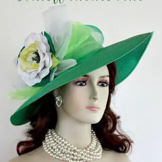 Ladies Kelly Green Wide Brim Formal Haute Couture Fashion Kentucky Derby Hat With Expensive Silk Millinery Flowers. This Custom Made Women's Designer Hat Is Embellished With A Large Kelly Green Crinoline Horsehair Bow, Mixed With A Lime Green Organza Bow. Beautiful Silk Handmade White, Lime And Kelly Green Flowers Are Placed In The Center Of This Bow.  A Hand Dyed Beaded Lime Green Velvet Trim Encircles The Crown Of This Fashion Hat. This Gorgeous Designer Hat Is Suited For A Bride To Be On Her Wedding Day, Horse Races, The Kentucky Derby, Breeder's Cup, Maryland Million Day, Iroquois Steeplechase Horse Races, The Melbourne Cup, The Royal Ascot, Church, Weddings, Formals, And Special Occasion. This Fashion Hat Is Custom Made By Women's Hats, hatswomens.com.