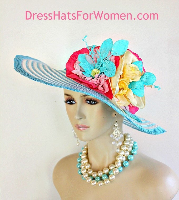 Women's Turquoise Blue White Statement Kentucky Derby Hat. This Wide Brim Designer Fashion Wedding Church Hat Is Embellished With Handmade Vintage Silk And Velvet Millinery Flower Assortment Adorned With Satin Bowing. Colors Include: An Array Of Pink Flowers, Yellow Roses, Aqua And Hand Painted Turquoise Blue Sequin Pearl Flowers. This Dramatic Spring Colored Hat Will Be The Talk Of The Town.